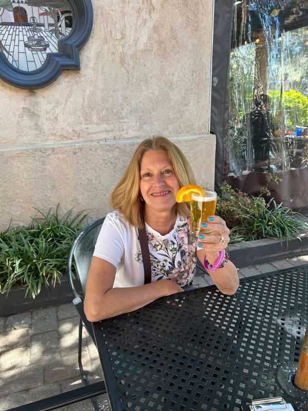 Community member raising a drink